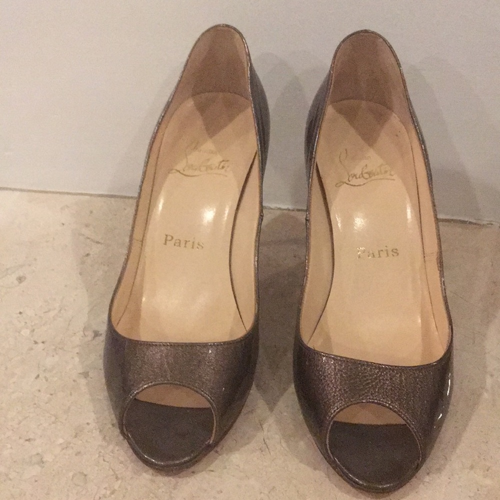 Christian Louboutin gold pumps